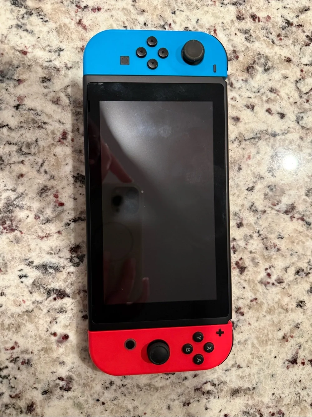 Nintendo Switch with Blue and Red Joy-Con